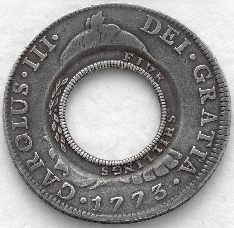 Spanish coin had the centre removed.